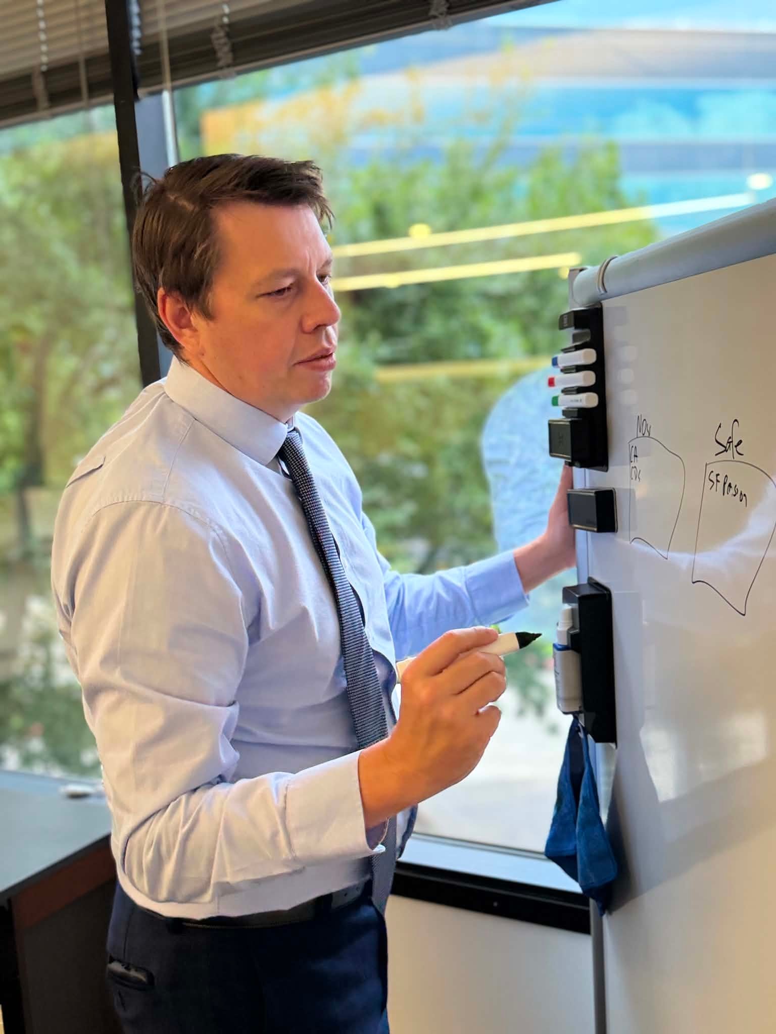 Clint Dubose presenting at a whiteboard